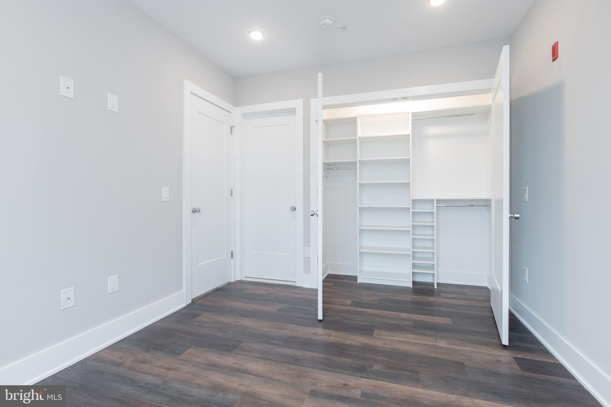 45 West Haines Street, Unit 303 Philadelphia, PA 19144 - Photo 13 of 24 a view of walk in closet with wooden floor