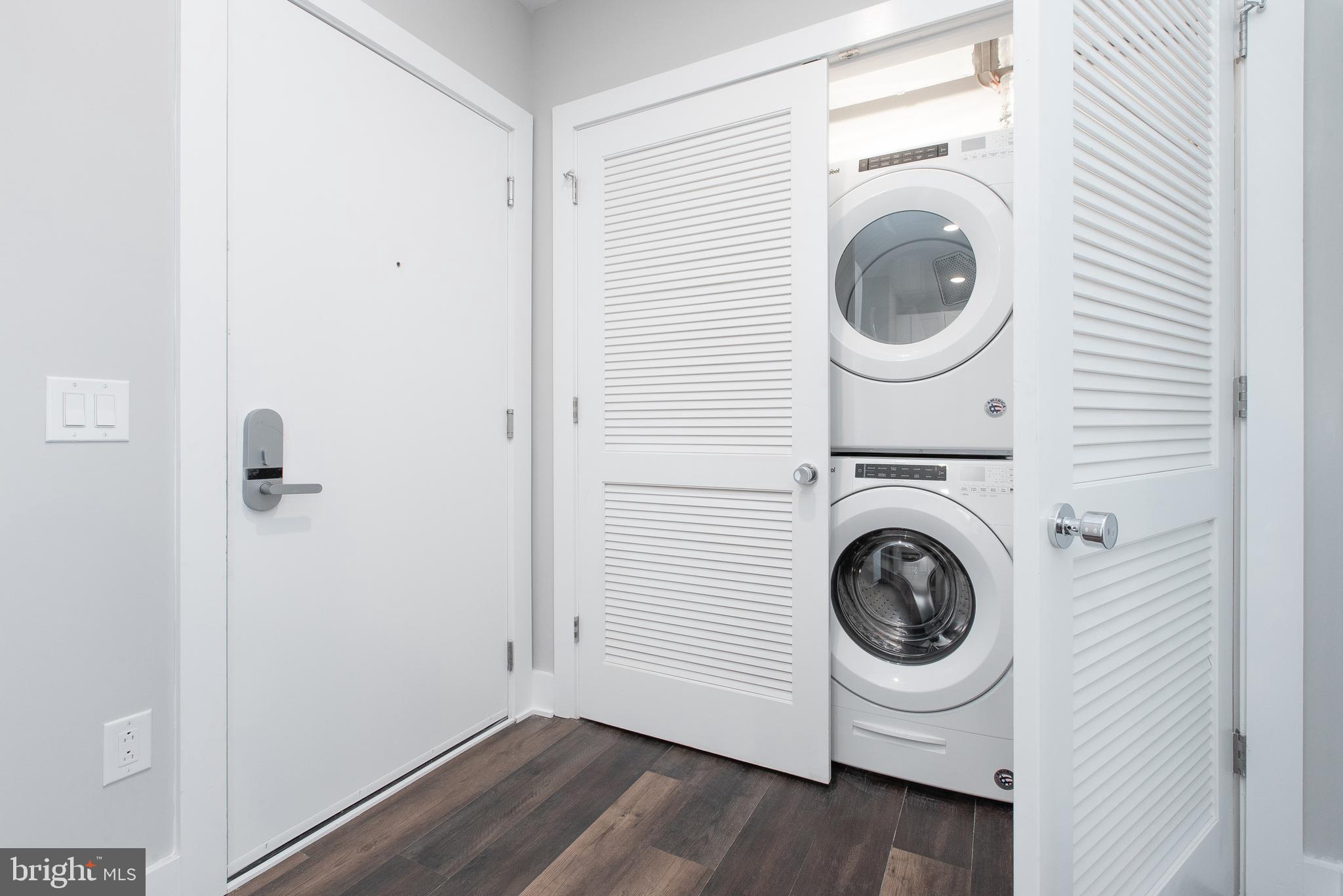 45 West Haines Street, Unit 303 Philadelphia, PA 19144 - Photo 22 of 24 a view of a hallway with washer and dryer