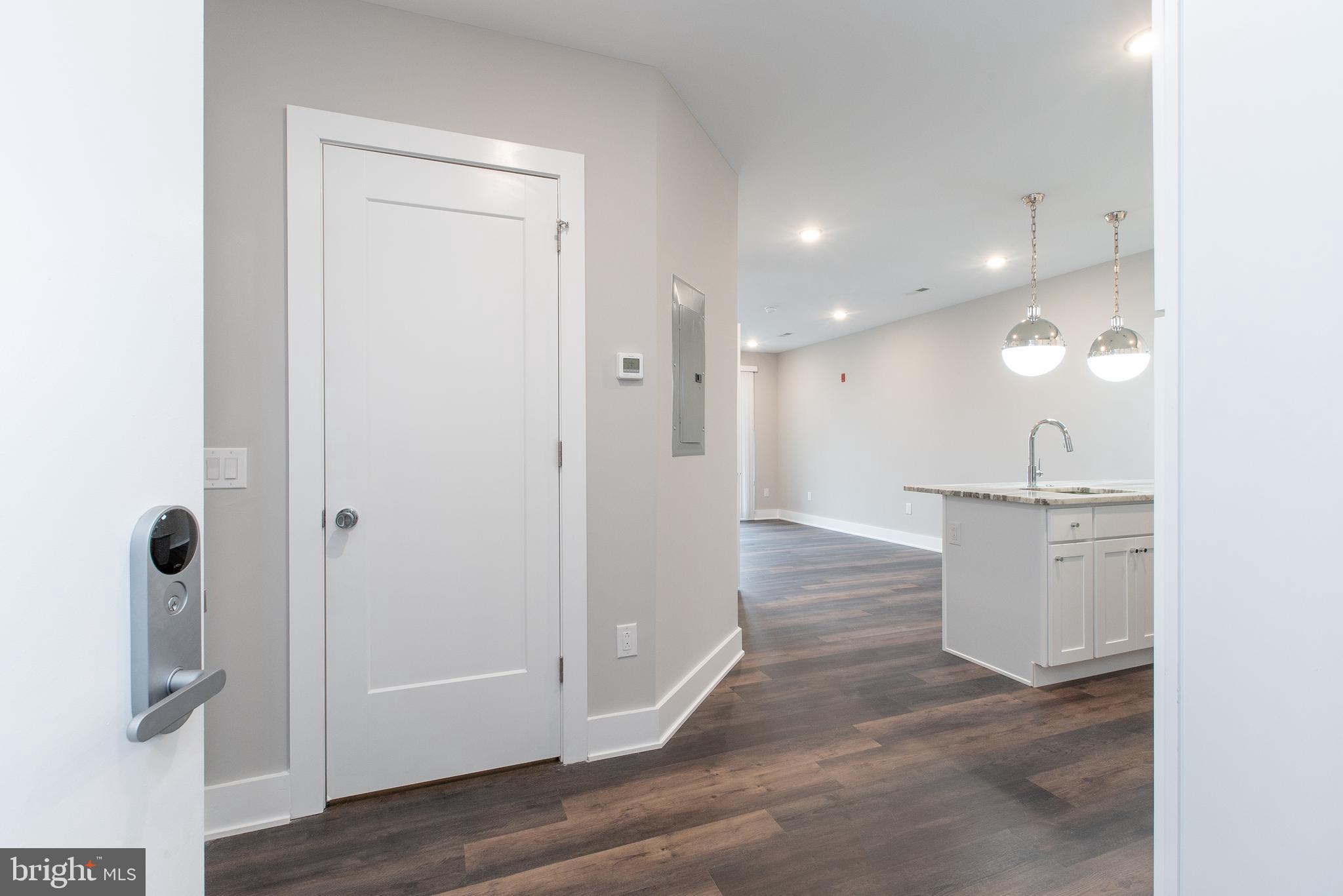 45 West Haines Street, Unit 303 Philadelphia, PA 19144 - Photo 10 of 24 a view of a kitchen from the hallway