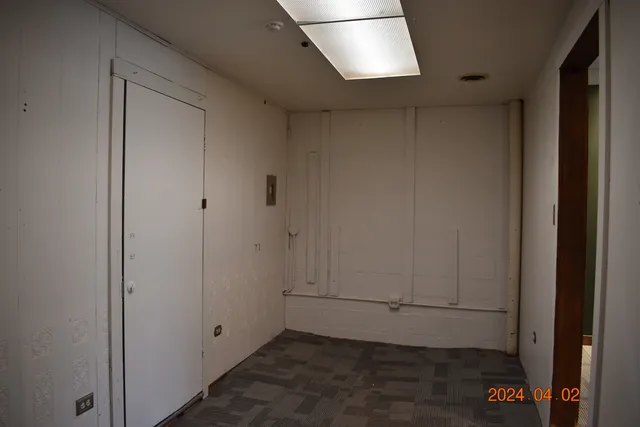 a view of a bathroom from a hallway