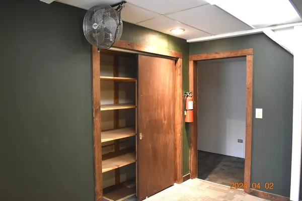 a view of room with wooden floor