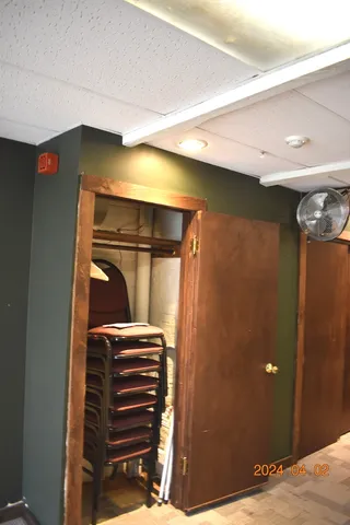 a view of hallway with a bathroom