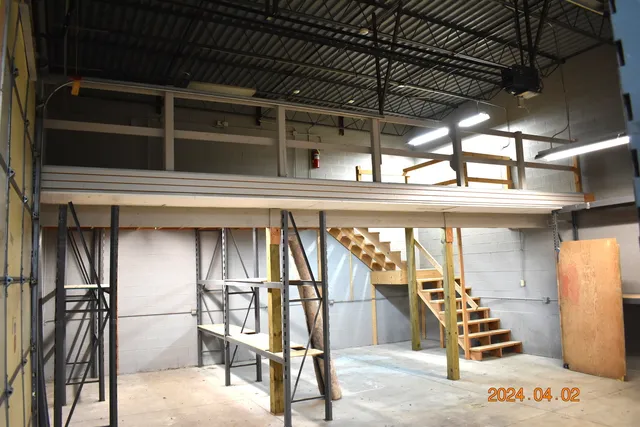 a view of an empty room with stairs