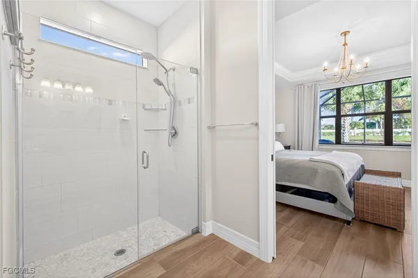 a spacious bedroom with a bed and a window