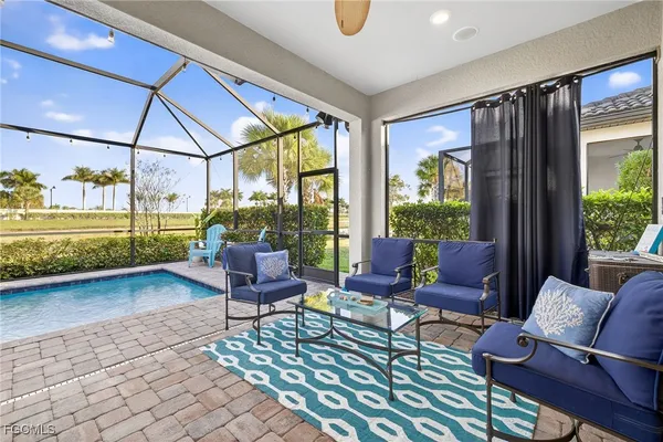 a living room with furniture and a garden