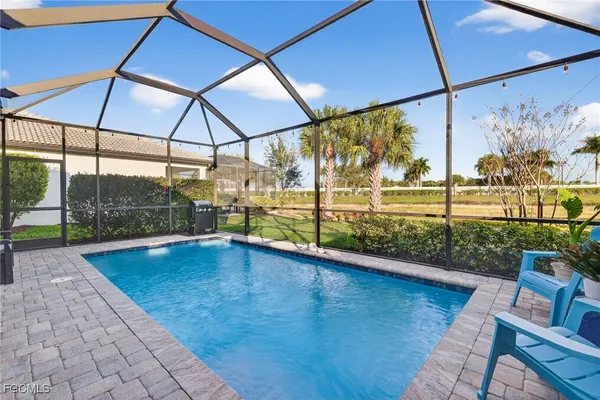 a view of swimming pool with a patio