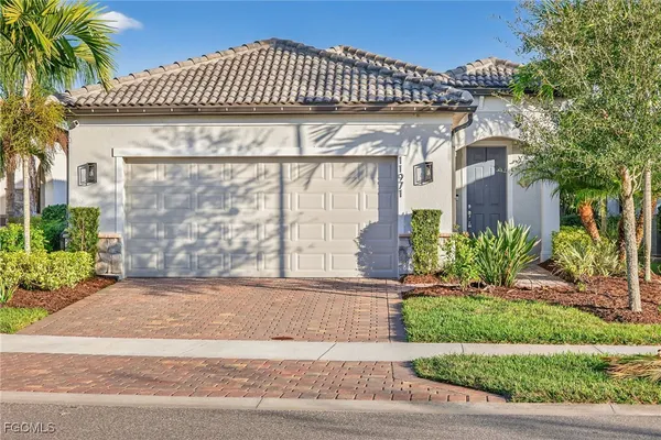 an aerial view of a house with a lake view