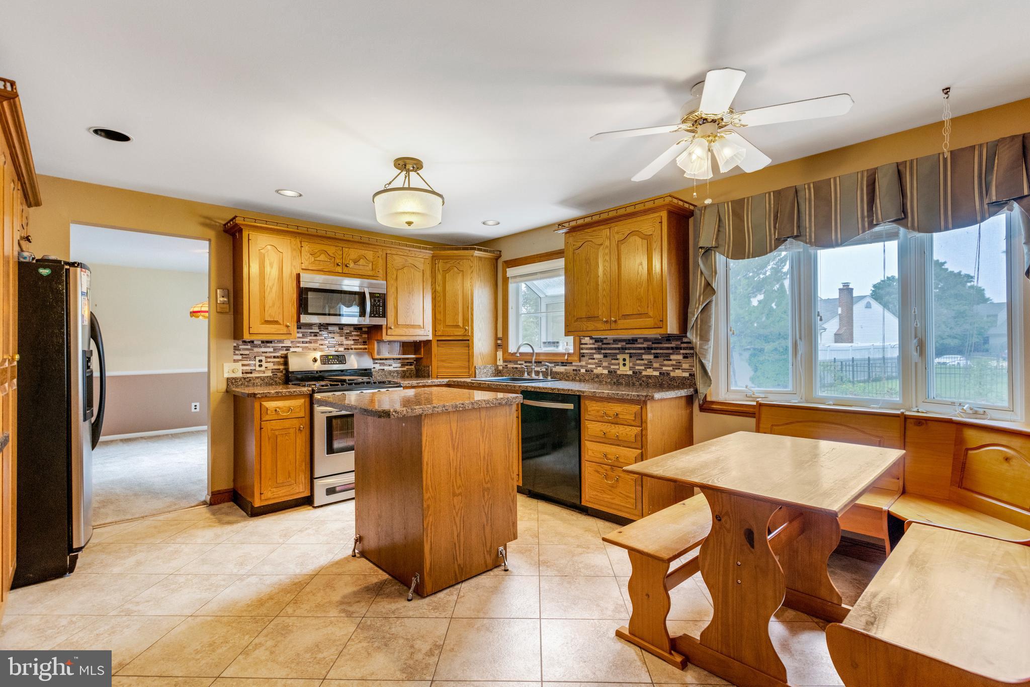 19 Candlestick Road Clementon, NJ 08021 - Photo 12 of 32 a kitchen with a refrigerator and a stove top oven