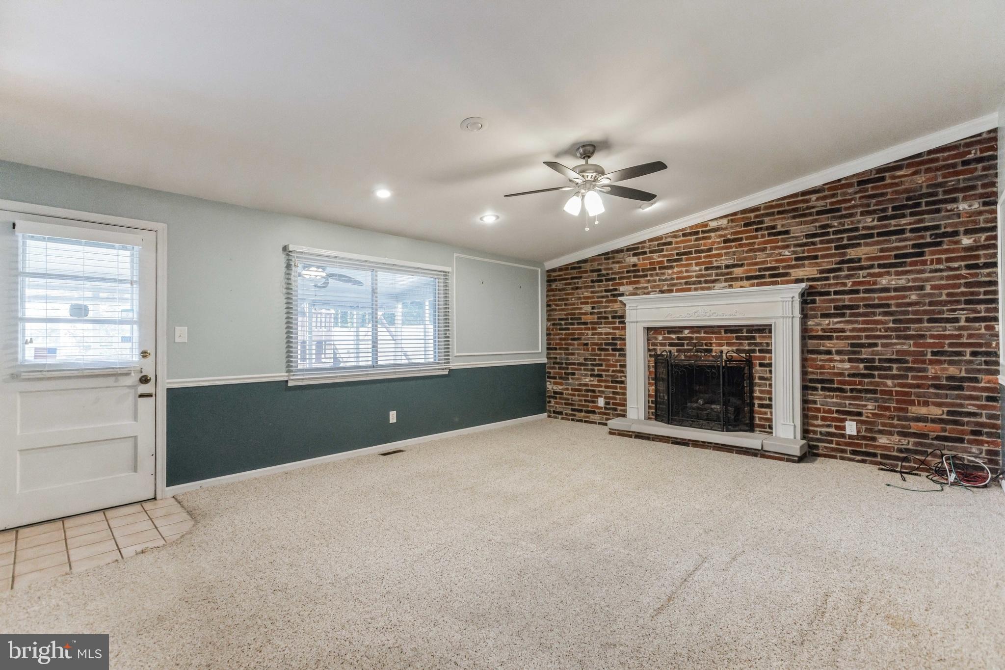 19 Candlestick Road Clementon, NJ 08021 - Photo 15 of 32 a view of an empty room with a fireplace and a window