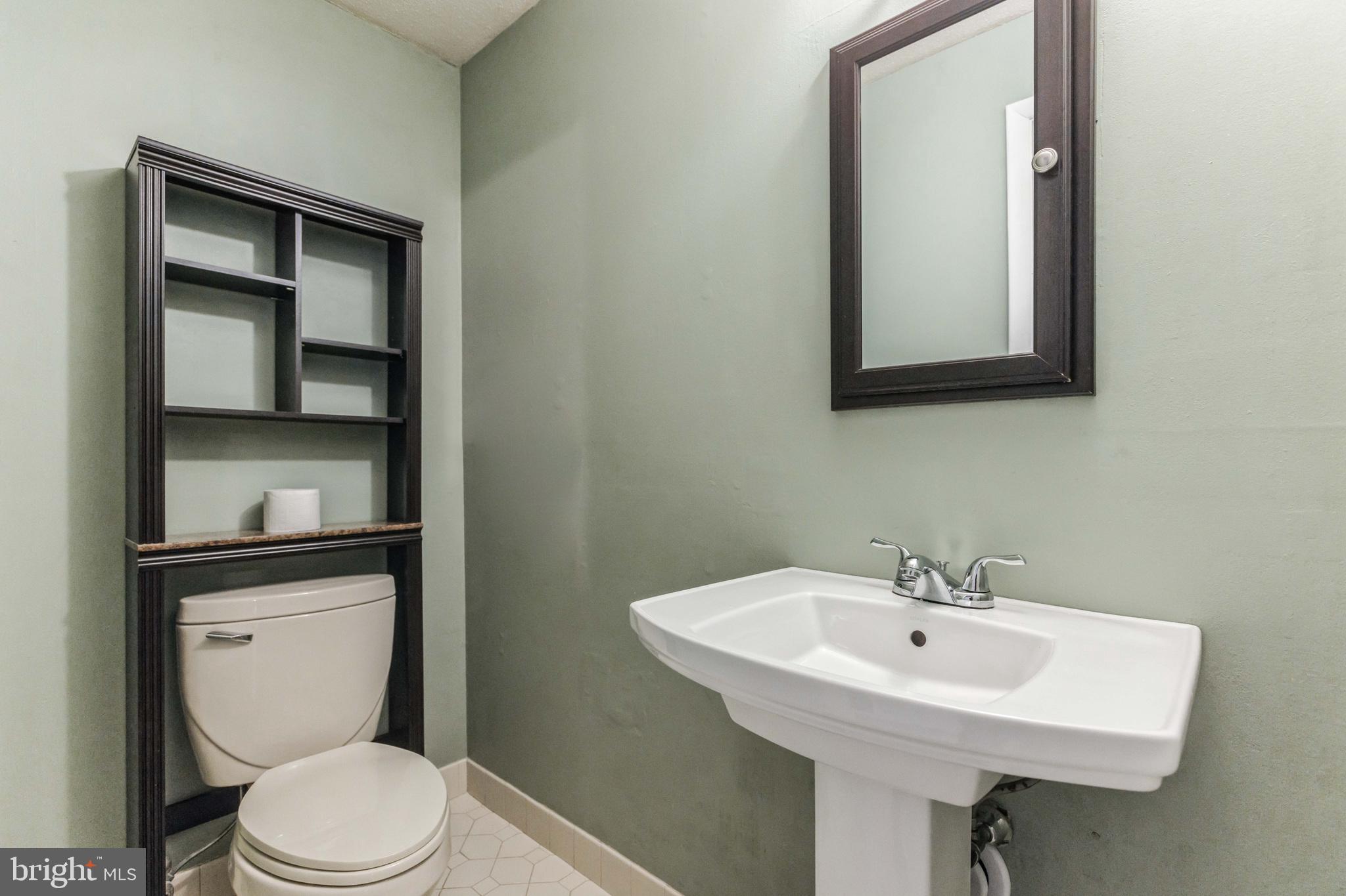19 Candlestick Road Clementon, NJ 08021 - Photo 18 of 32 a bathroom with a toilet sink and mirror