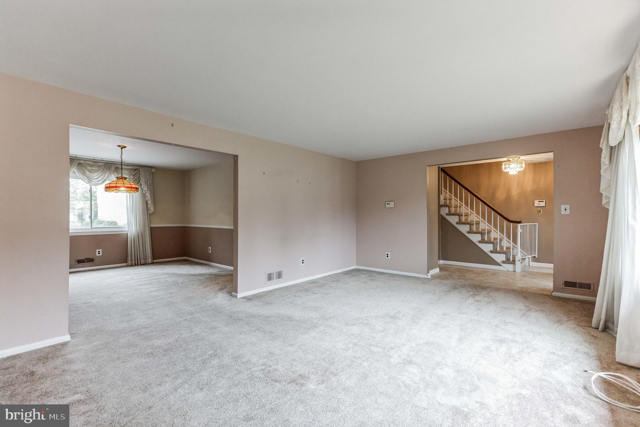 19 Candlestick Road Clementon, NJ 08021 - Photo 8 of 32 an empty room with a fireplace and windows