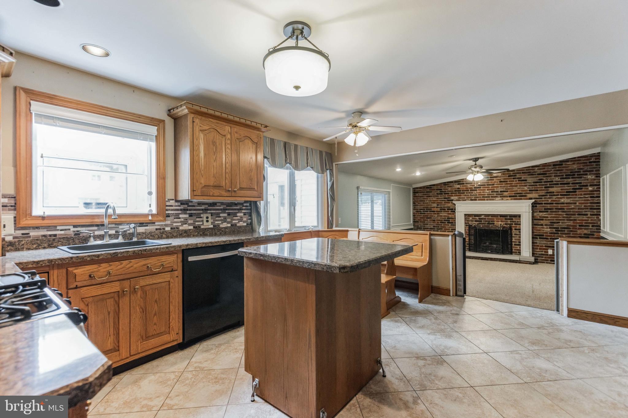 19 Candlestick Road Clementon, NJ 08021 - Photo 10 of 32 a kitchen with kitchen island granite countertop a sink counter top space appliances and cabinets