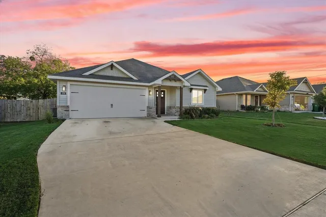 front view of a house with a yard