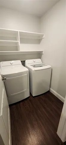 a view of a hallway view with wooden floor and staircase