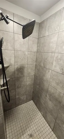 a spacious bathroom with a double vanity sink and mirror