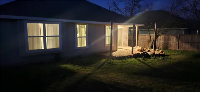 a backyard of a house with garden