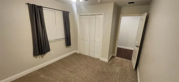 a view of hallway with wooden floor