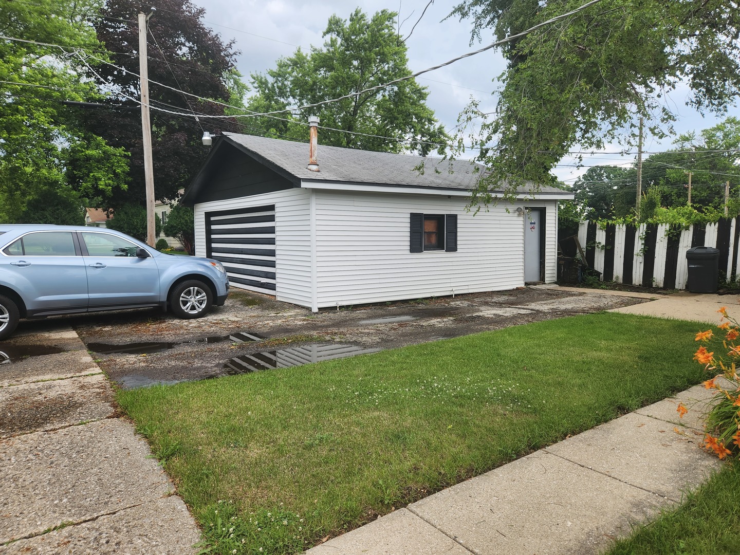 1228 20th Street North Chicago, IL 60064 - Photo 14 of 14 a view of a car parked in the yard