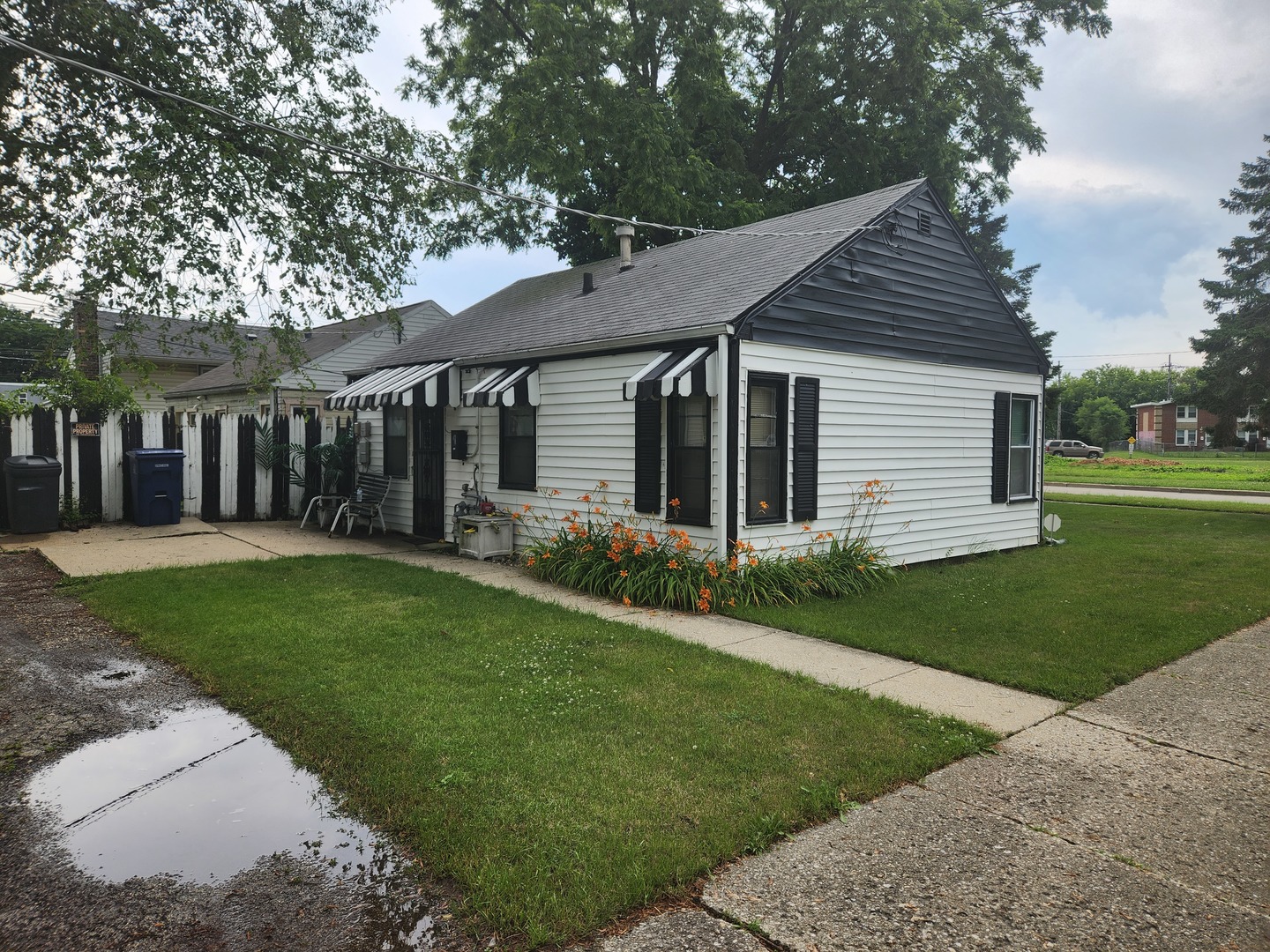 1228 20th Street North Chicago, IL 60064 - Photo 2 of 14 a front view of a house with garden