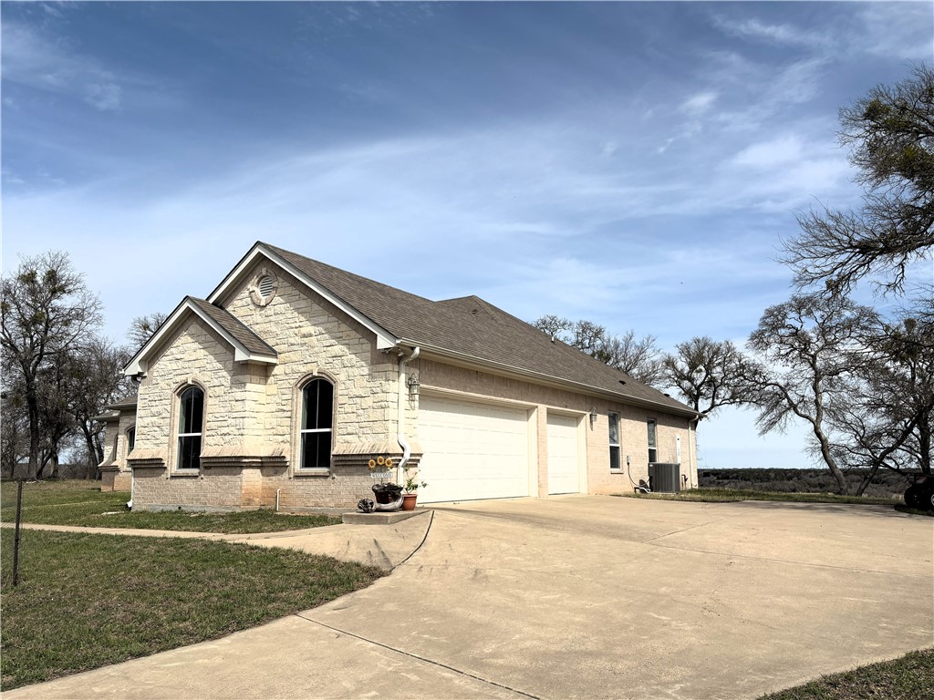 17452 Deer Ridge Road Moody, TX 76557 - Photo 16 of 60 a front view of a house with a yard and trees