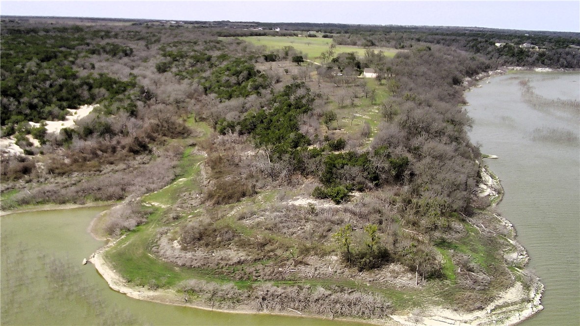 17452 Deer Ridge Road Moody, TX 76557 - Photo 42 of 60 a view of a wooden floor with a lake view