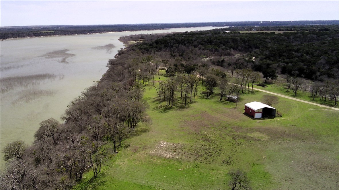 17452 Deer Ridge Road Moody, TX 76557 - Photo 7 of 60 a view of a lake from a yard