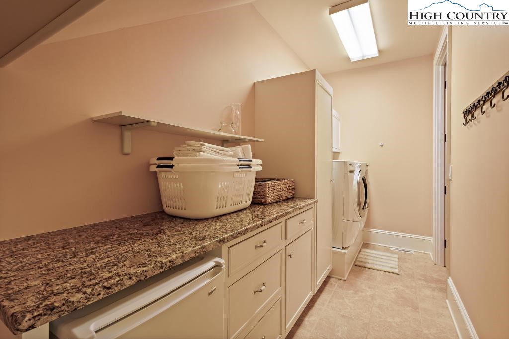 766 Turtle Creek Drive, Unit 3A Boone, NC 28607 - Photo 22 of 46 a bathroom with a granite countertop sink and a mirror