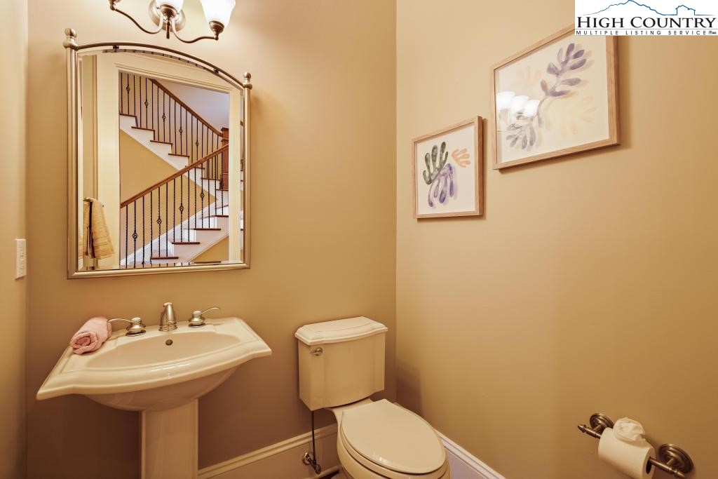 766 Turtle Creek Drive, Unit 3A Boone, NC 28607 - Photo 23 of 46 a bathroom with a toilet sink and mirror