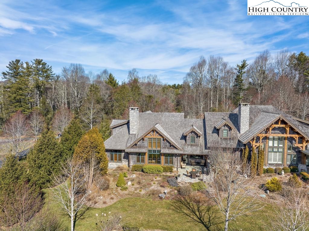 766 Turtle Creek Drive, Unit 3A Boone, NC 28607 - Photo 42 of 46 a front view of a house with a yard and mountain view in back