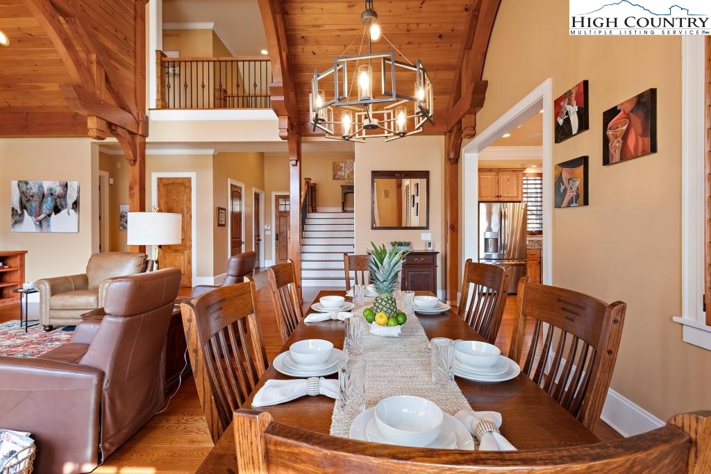 766 Turtle Creek Drive, Unit 3A Boone, NC 28607 - Photo 10 of 46 a view of a dining room with furniture a chandelier and wooden floor