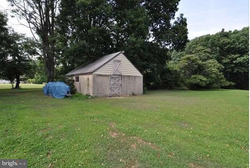 2091 Old York Road Burlington, NJ 08016 - Photo 16 of 20 Charming shed nestled in lush greenery.