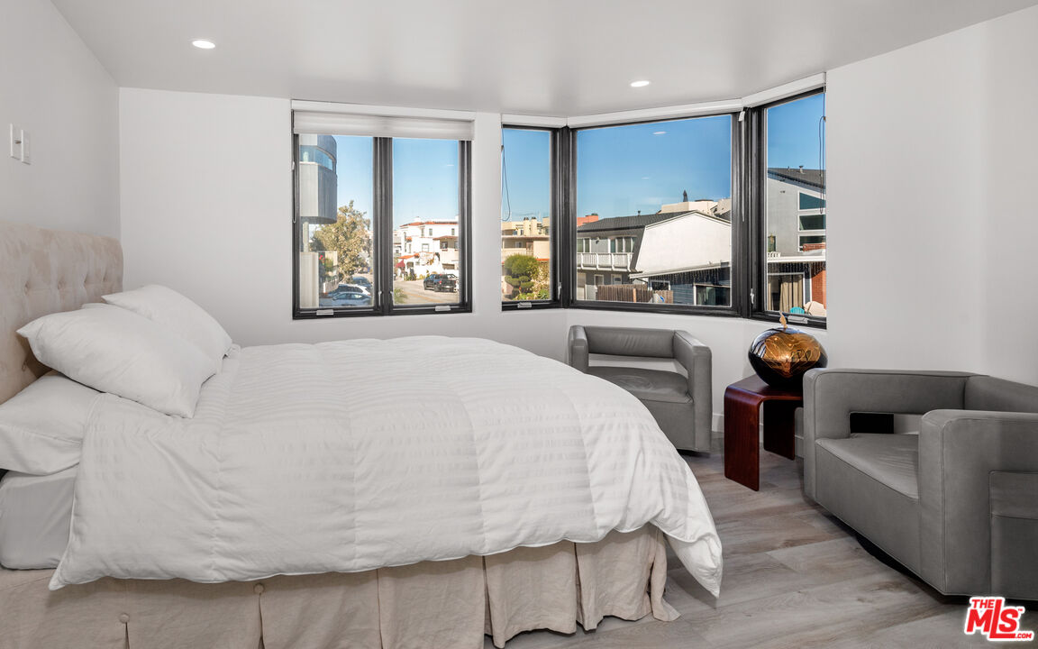 3461 Ocean Drive Oxnard, CA 93035 - Photo 15 of 30 a large white bed sitting in a bedroom next to a window