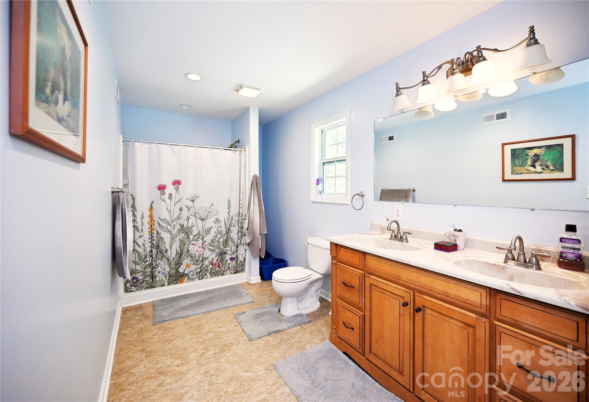 1845 State Rd S-46-149 Clover, SC 29710 - Photo 16 of 28 a spacious bathroom with a toilet sink and mirror