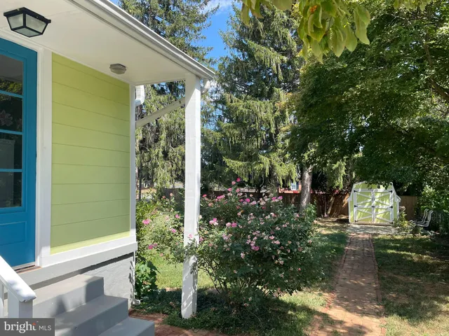 a view of a house with a tree