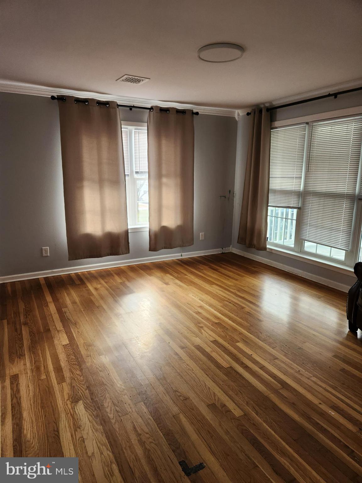 501 South Seminary Street Charles Town, WV 25414 - Photo 2 of 18 wooden floor in an empty room with a window