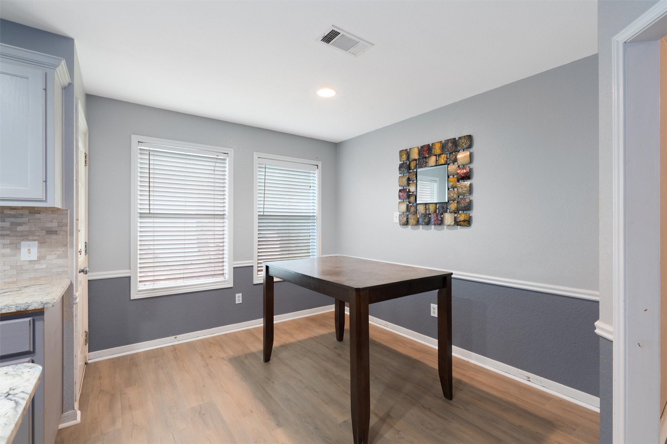 2306 Raintree Path Round Rock, TX 78664 - Photo 13 of 23 A well-lit dining area offers a seamless flow with the adjacent kitchen space.