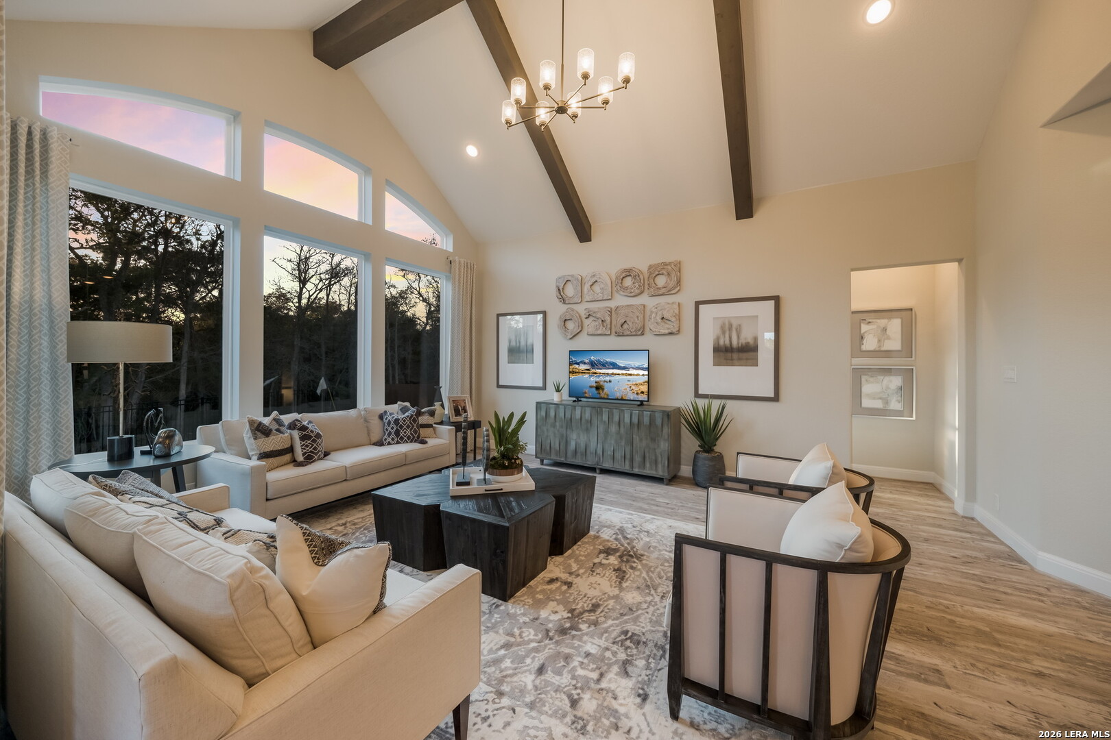 417 Fandango Boerne, TX 78006 - Photo 14 of 37 a living room with furniture a large window and a chandelier