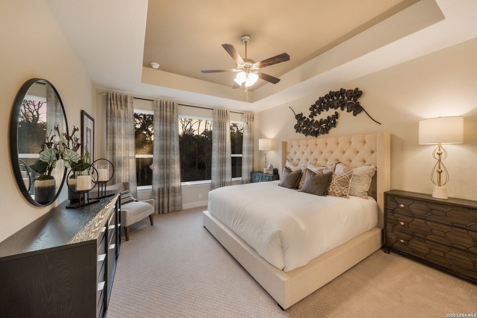 417 Fandango Boerne, TX 78006 - Photo 15 of 37 a bedroom with a large bed and a chandelier