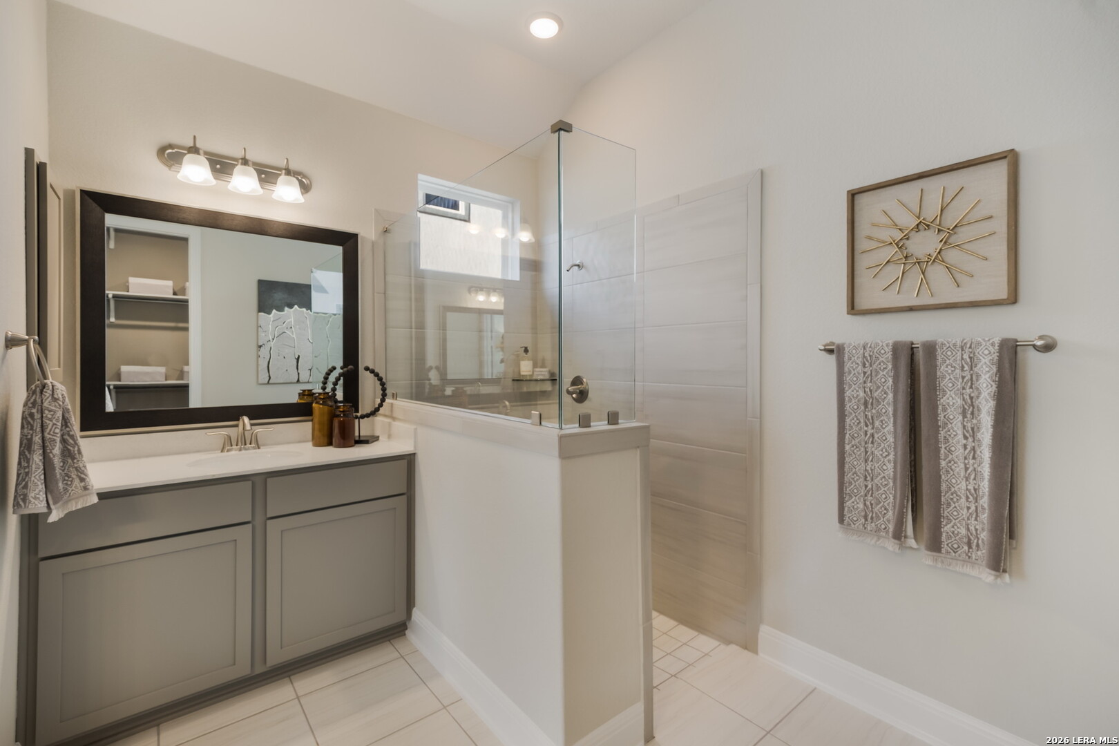 417 Fandango Boerne, TX 78006 - Photo 17 of 37 a bathroom with a double vanity sink and a mirror