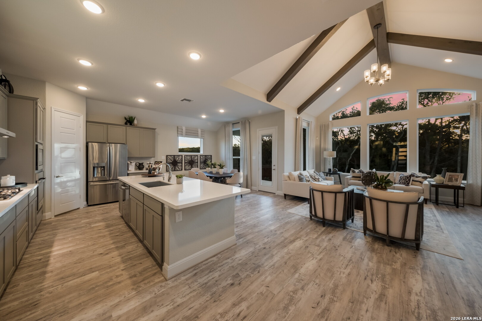 417 Fandango Boerne, TX 78006 - Photo 7 of 37 a large white kitchen with a large window and stainless steel appliances