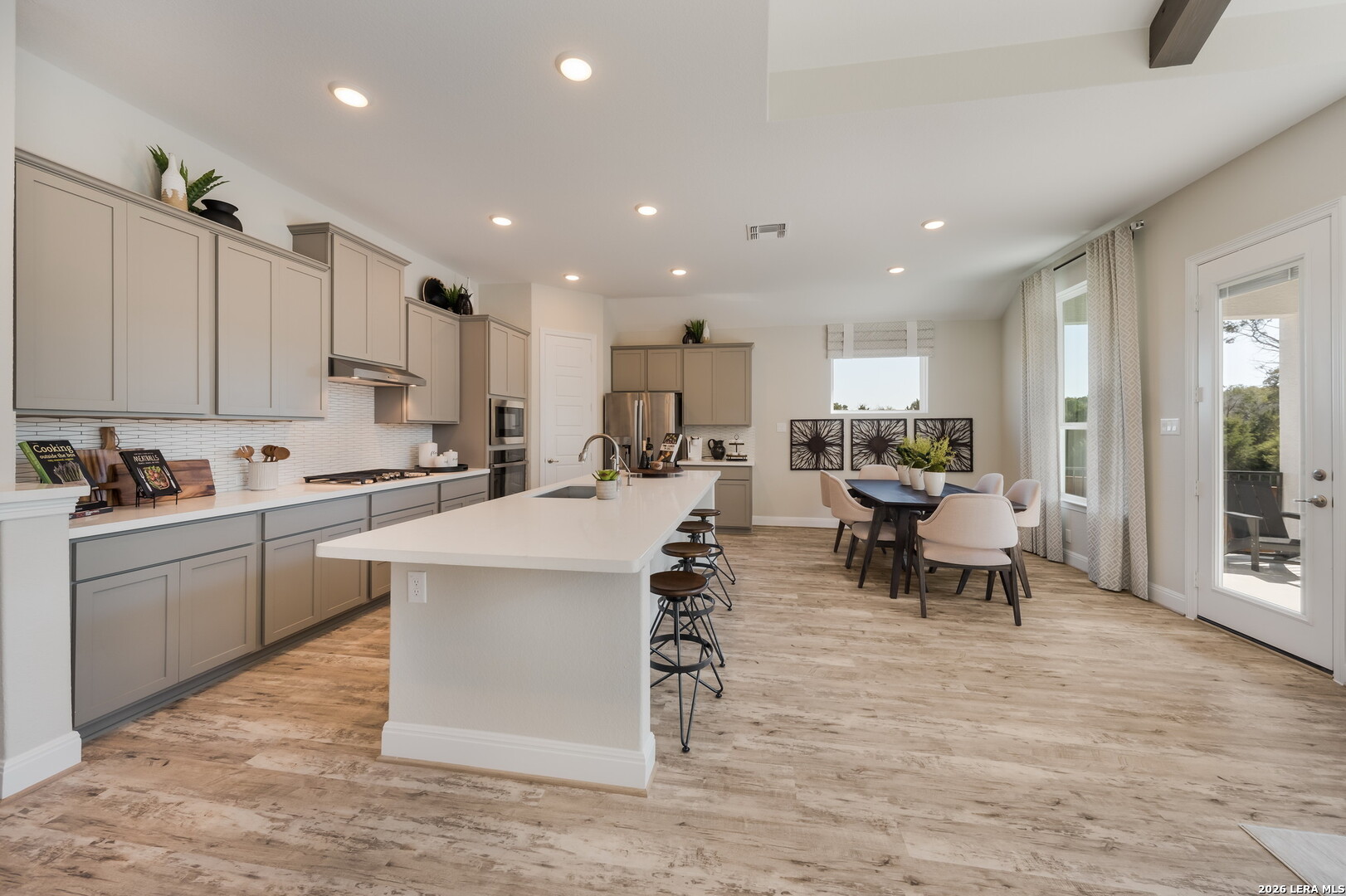 417 Fandango Boerne, TX 78006 - Photo 8 of 37 a living room with stainless steel appliances kitchen island granite countertop furniture and a view of living room