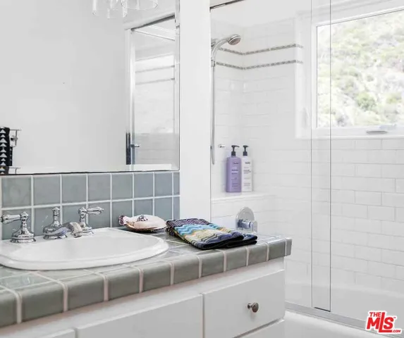 a bathroom with a tub and a sink