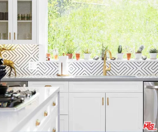 a kitchen with cabinets and chairs