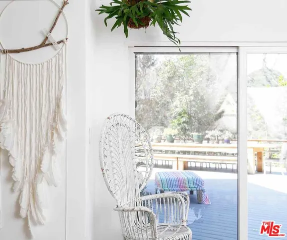 a view of a balcony with furniture