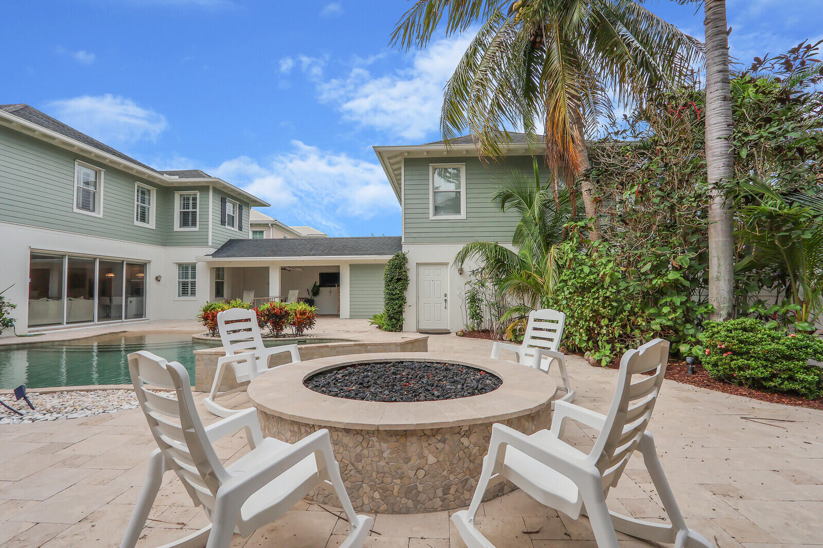 101 St Pierre Way Jupiter, FL 33458 - Photo 54 of 57 a view of a house with backyard and sitting area