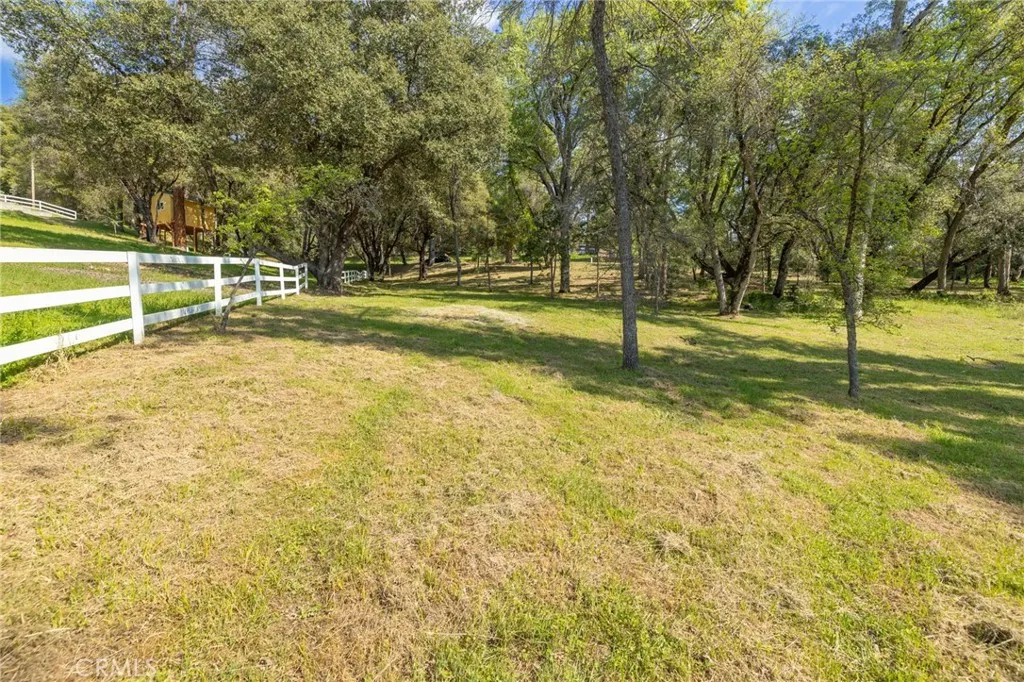 1 Oak Oakhurst, CA 93644 - Photo 25 of 48 a view of a swimming pool with an outdoor space and seating area