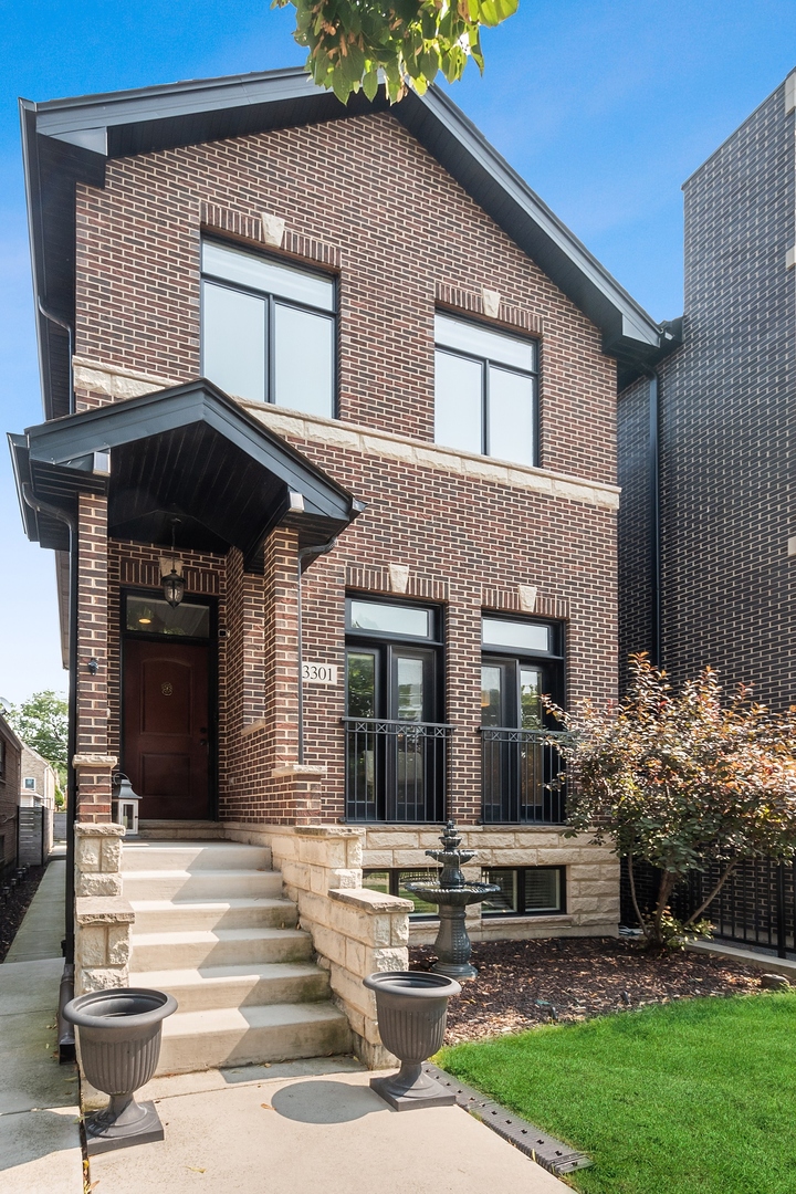 a view of a house with a small yard and plants