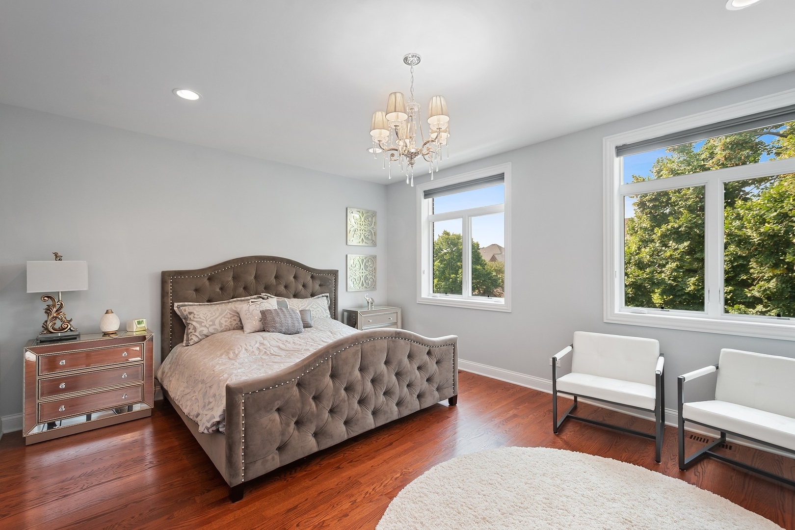 3301 South Racine Avenue Chicago, IL 60608 - Photo 11 of 32 a bedroom with a bed wooden floor and a large window