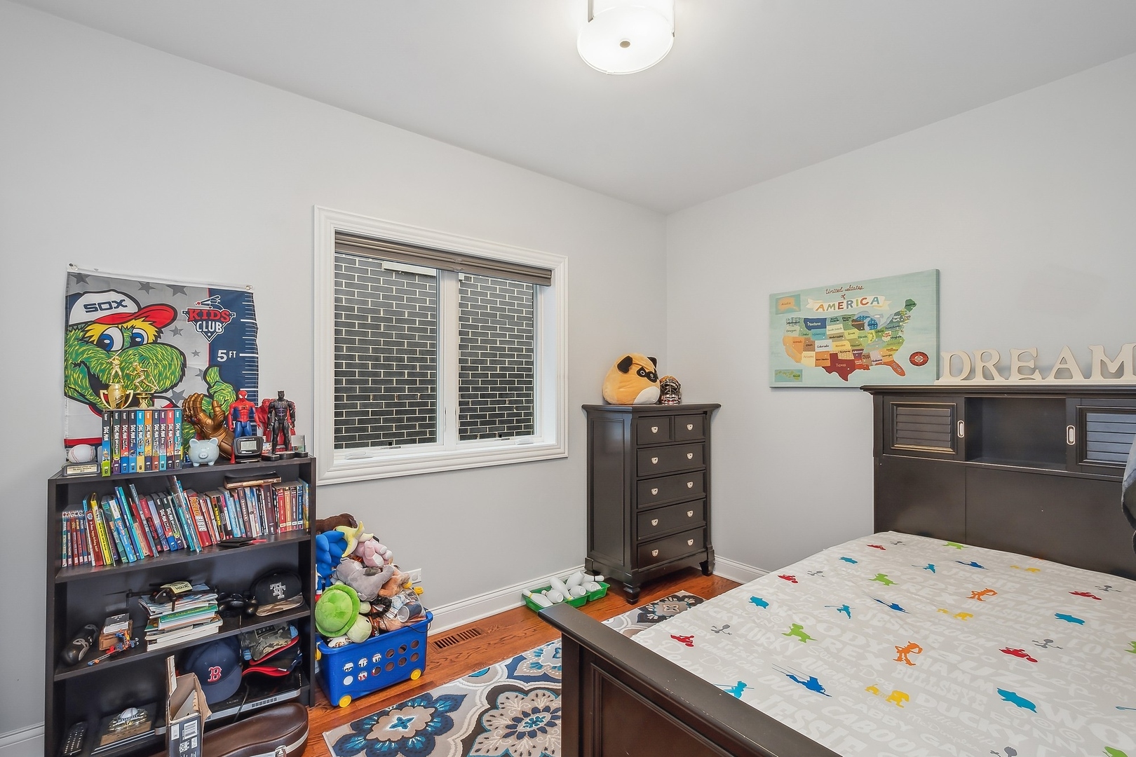 3301 South Racine Avenue Chicago, IL 60608 - Photo 13 of 32 a bedroom with a bed and wooden floor