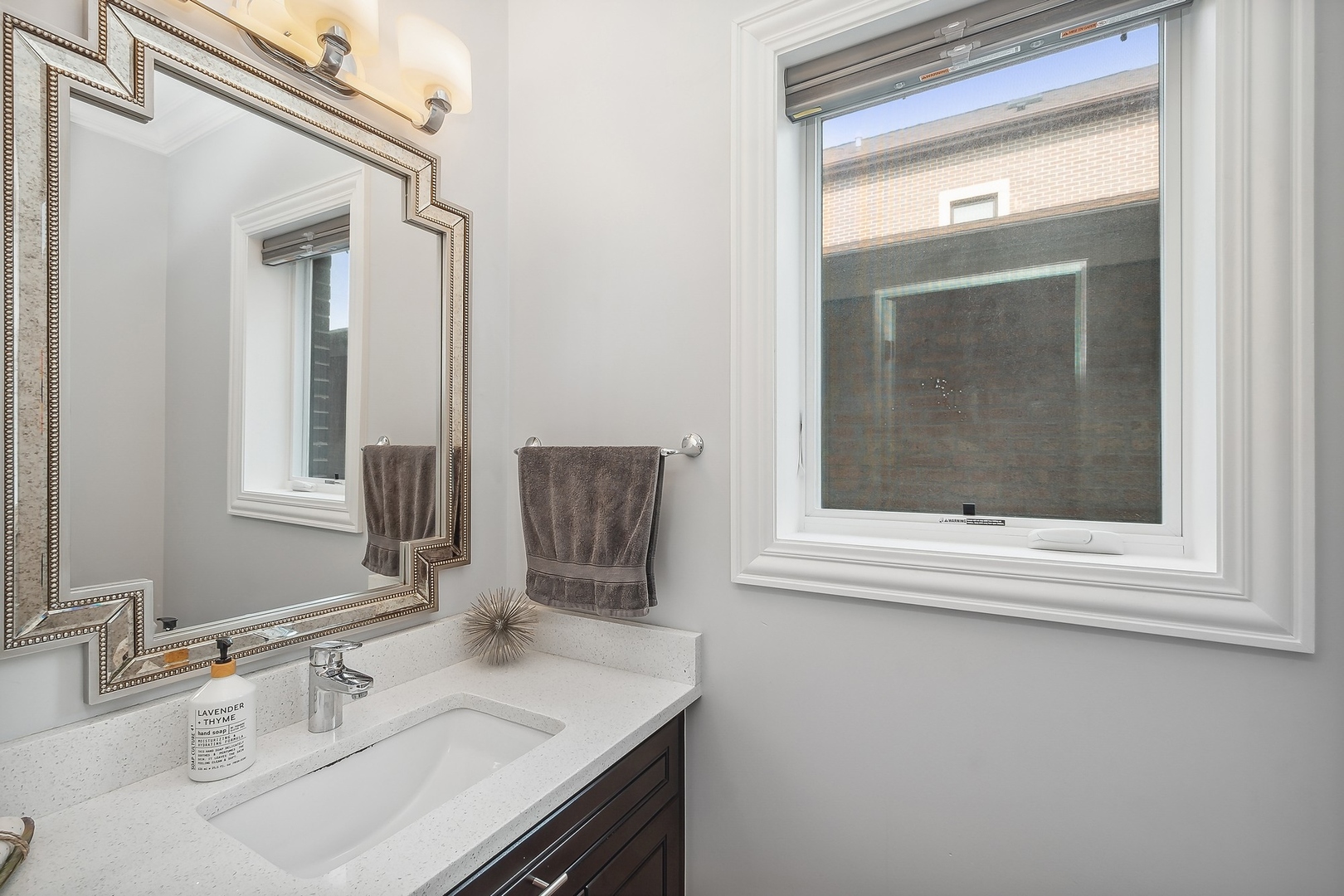 3301 South Racine Avenue Chicago, IL 60608 - Photo 20 of 32 a bathroom with a sink and a mirror